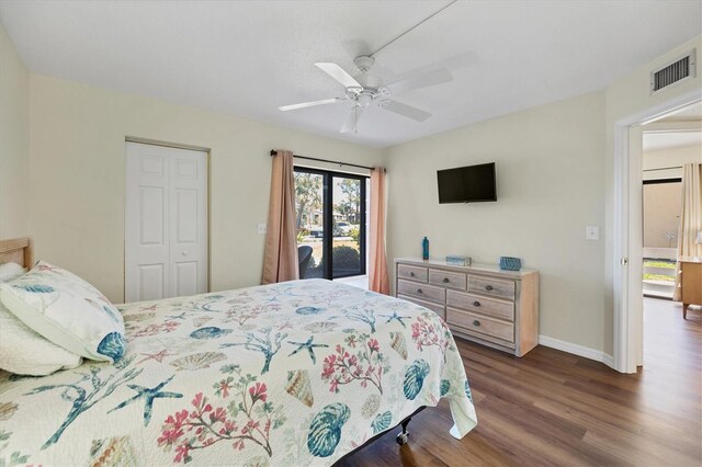 bedroom featuring ceiling fan, access to exterior, a closet, and dark hardwood / wood-style floors