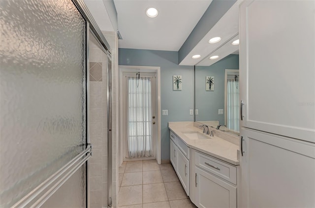 bathroom featuring tile flooring and oversized vanity