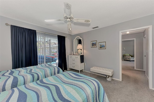 bedroom with light colored carpet, ceiling fan, and access to outside