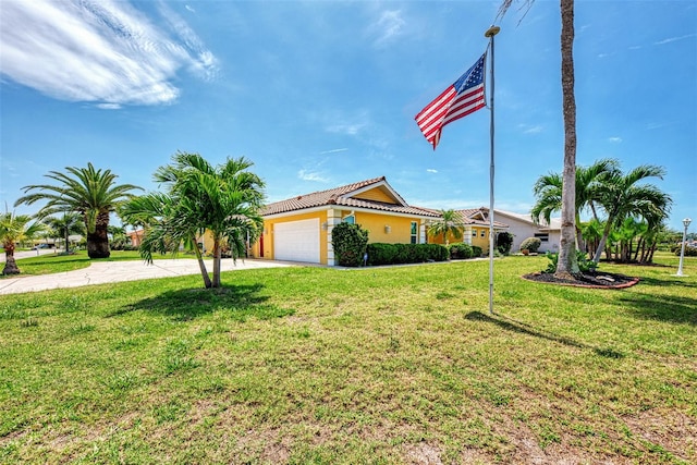 view of front facade with a front yard and a garage