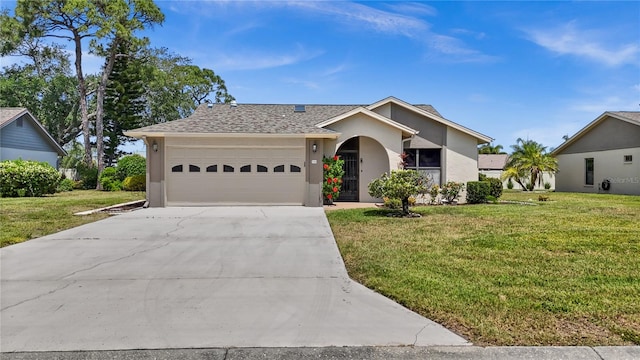 ranch-style home featuring a garage and a front yard