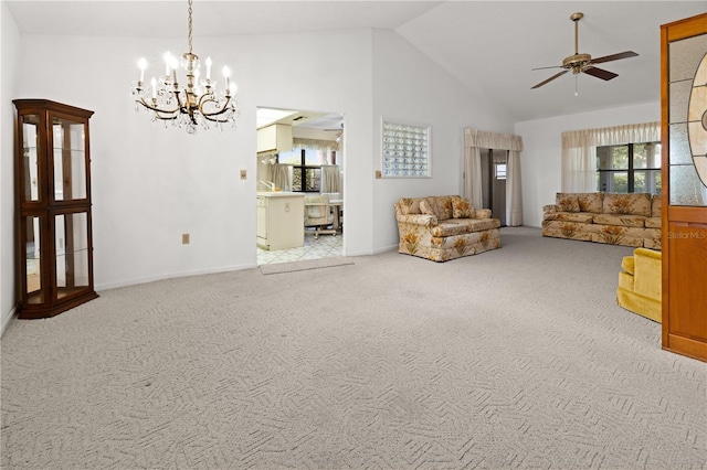 living room featuring high vaulted ceiling, light carpet, and ceiling fan with notable chandelier