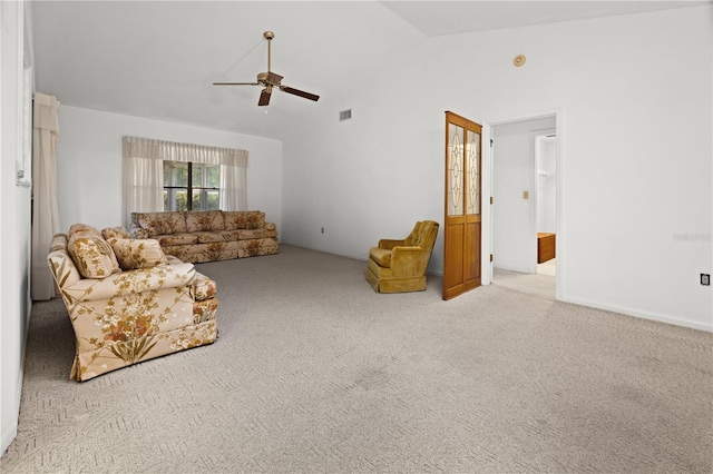 living room featuring ceiling fan, high vaulted ceiling, and light carpet