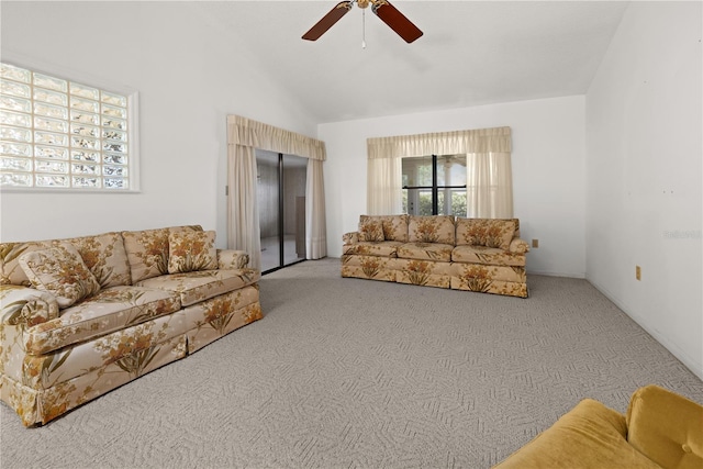 carpeted living room featuring ceiling fan and lofted ceiling