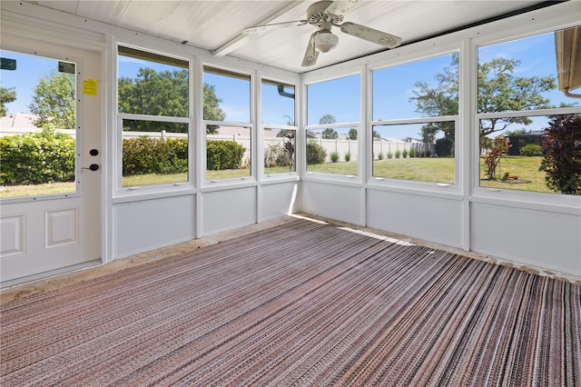 unfurnished sunroom with ceiling fan and a wealth of natural light