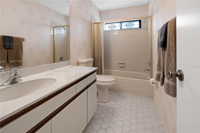 full bathroom featuring tile flooring, toilet, oversized vanity, and tiled shower / bath