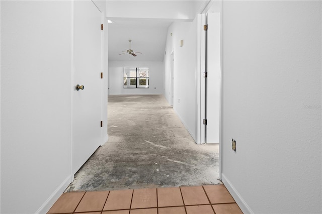 hallway featuring lofted ceiling