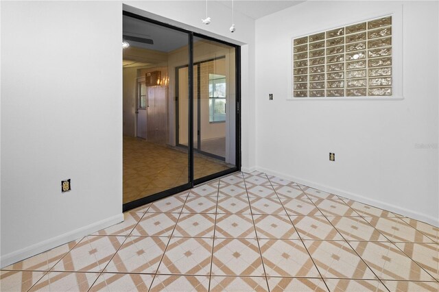 empty room with light tile patterned flooring