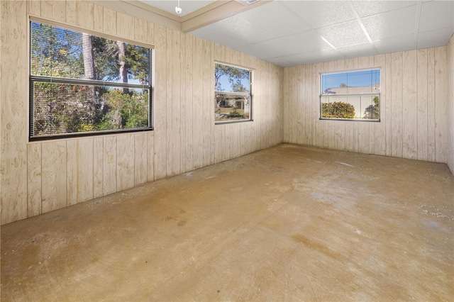 empty room featuring wooden walls