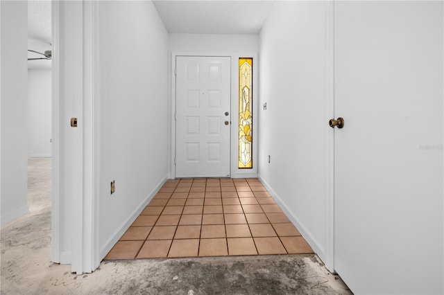 doorway with light tile patterned flooring