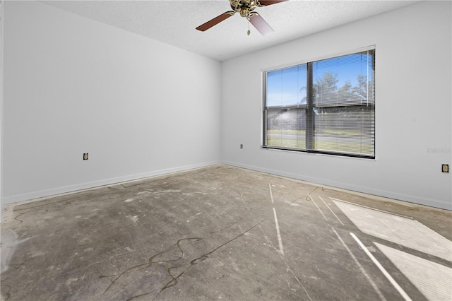 empty room featuring ceiling fan and a textured ceiling