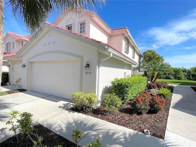 view of side of property with a garage