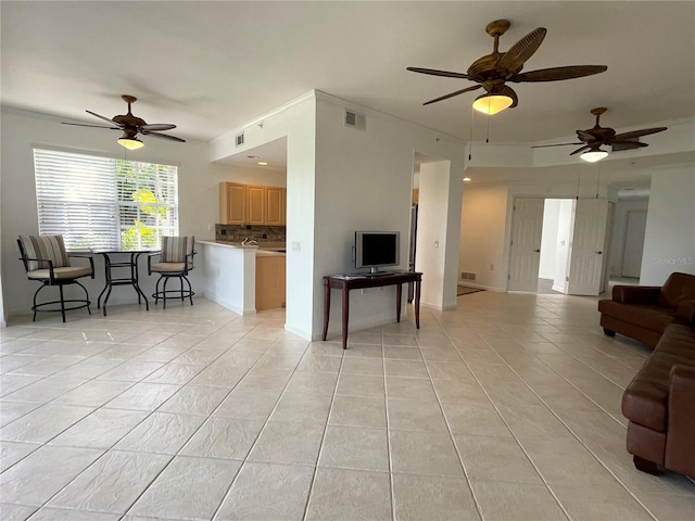 tiled living room featuring ceiling fan