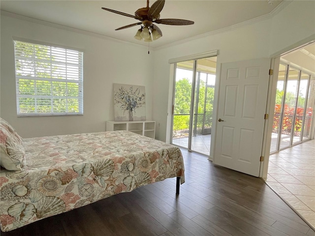 bedroom featuring crown molding, hardwood / wood-style flooring, ceiling fan, access to exterior, and multiple windows