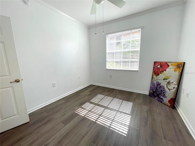 spare room with crown molding, dark hardwood / wood-style floors, and ceiling fan