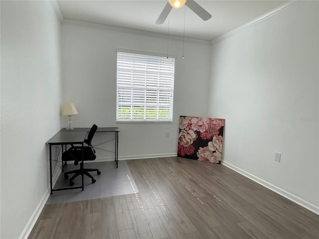 unfurnished office with crown molding, wood-type flooring, and ceiling fan