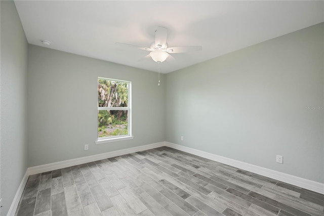 unfurnished room with ceiling fan and light hardwood / wood-style floors