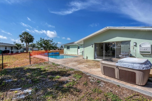 exterior space with a fenced in pool and a patio