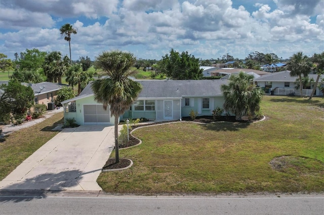 ranch-style house with a garage and a front yard