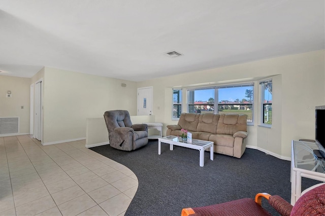 living room featuring light tile floors