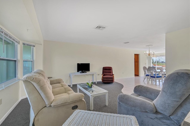 tiled living room with an inviting chandelier