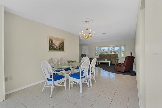 dining room with light tile flooring and a chandelier