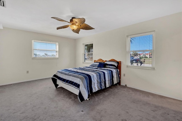 carpeted bedroom with ceiling fan