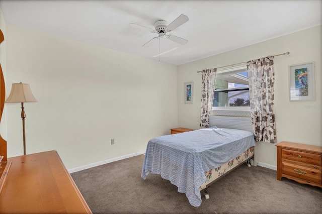 bedroom with dark colored carpet and ceiling fan