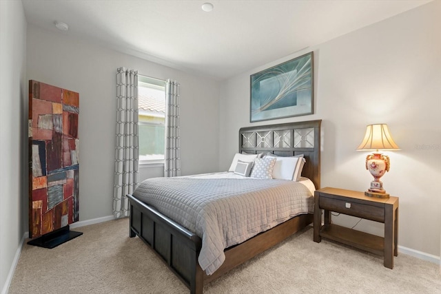 bedroom featuring light colored carpet