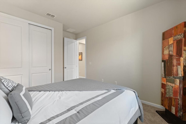 bedroom with carpet floors and a closet