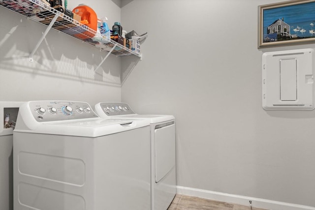 laundry room featuring separate washer and dryer