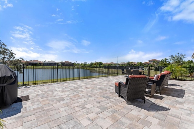 view of patio featuring a water view