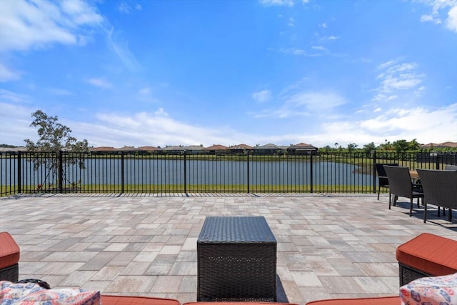 view of patio featuring a water view