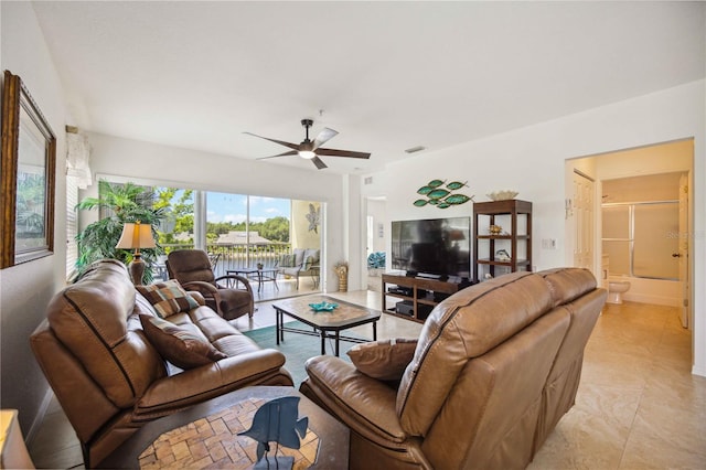 tiled living room featuring ceiling fan