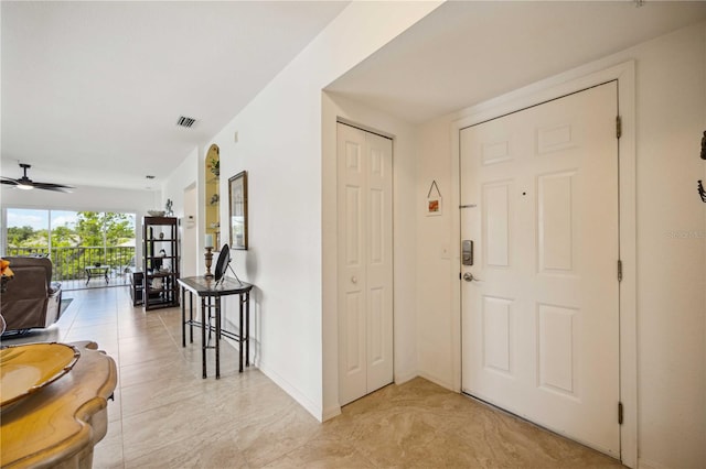 interior space featuring light tile floors