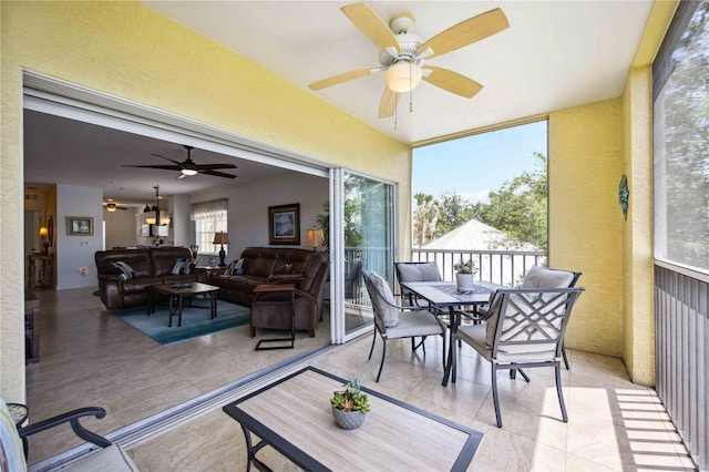 sunroom / solarium with ceiling fan