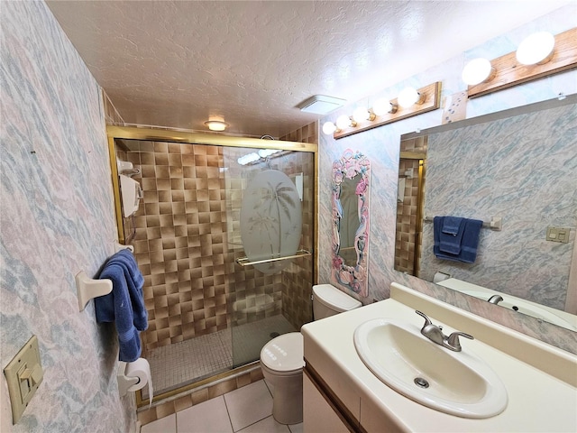 bathroom with toilet, tile patterned flooring, a shower with door, and a textured ceiling