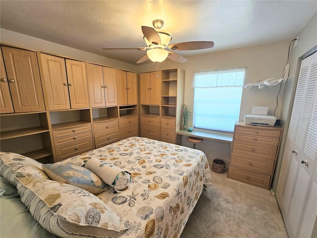 carpeted bedroom with ceiling fan