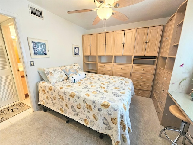 bedroom featuring ceiling fan and light colored carpet