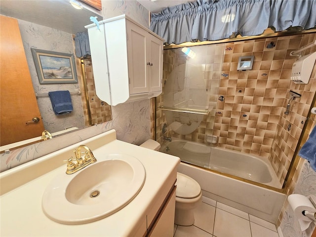 full bathroom with toilet, bath / shower combo with glass door, tile patterned floors, and vanity