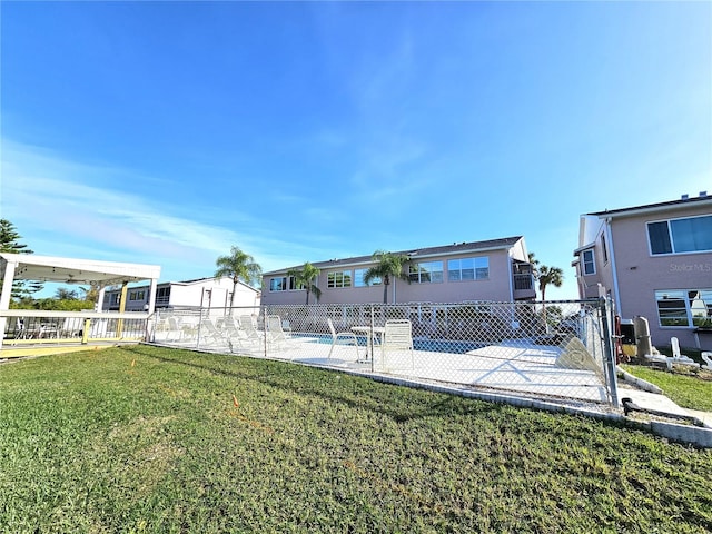 exterior space featuring a fenced in pool and a patio