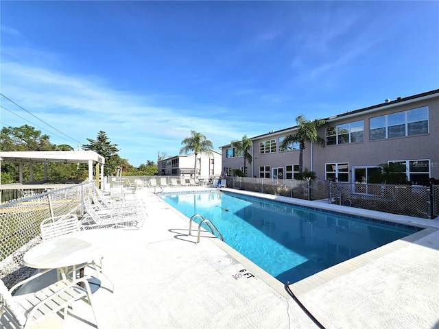 view of swimming pool with a patio area