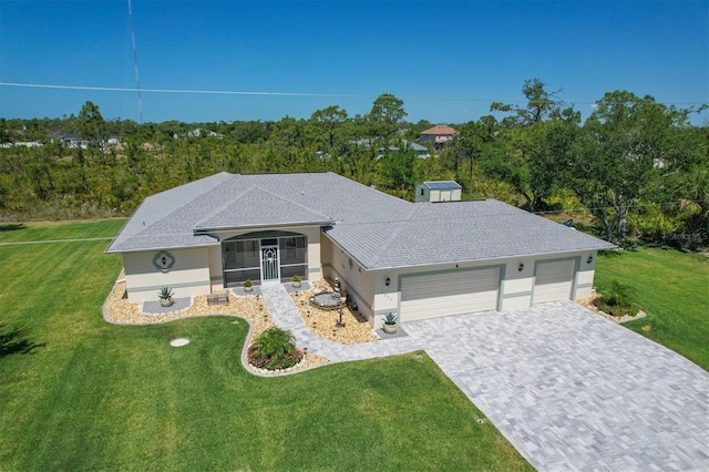 ranch-style house with a garage and a front yard