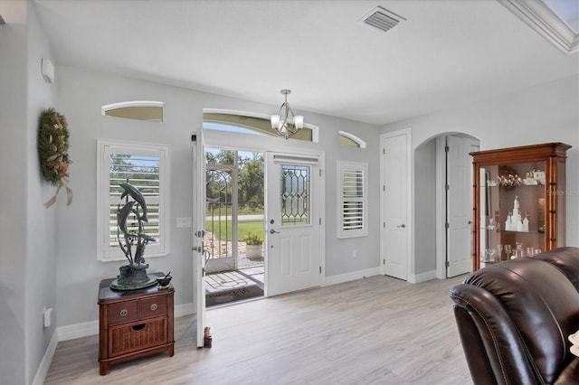 entryway featuring a notable chandelier and light hardwood / wood-style flooring