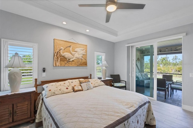 bedroom with multiple windows, ceiling fan, light wood-type flooring, and access to exterior