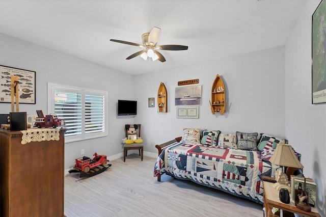 bedroom with ceiling fan and light wood-type flooring