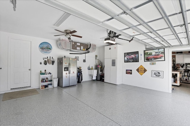 garage featuring water heater, ceiling fan, and a garage door opener