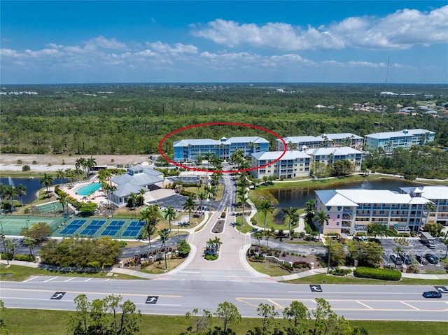 birds eye view of property with a water view