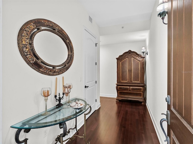 hallway with dark wood-type flooring