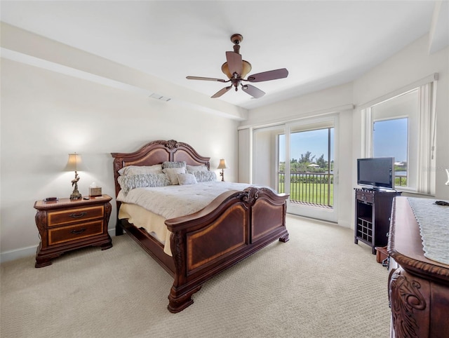 bedroom with light colored carpet, access to outside, and ceiling fan